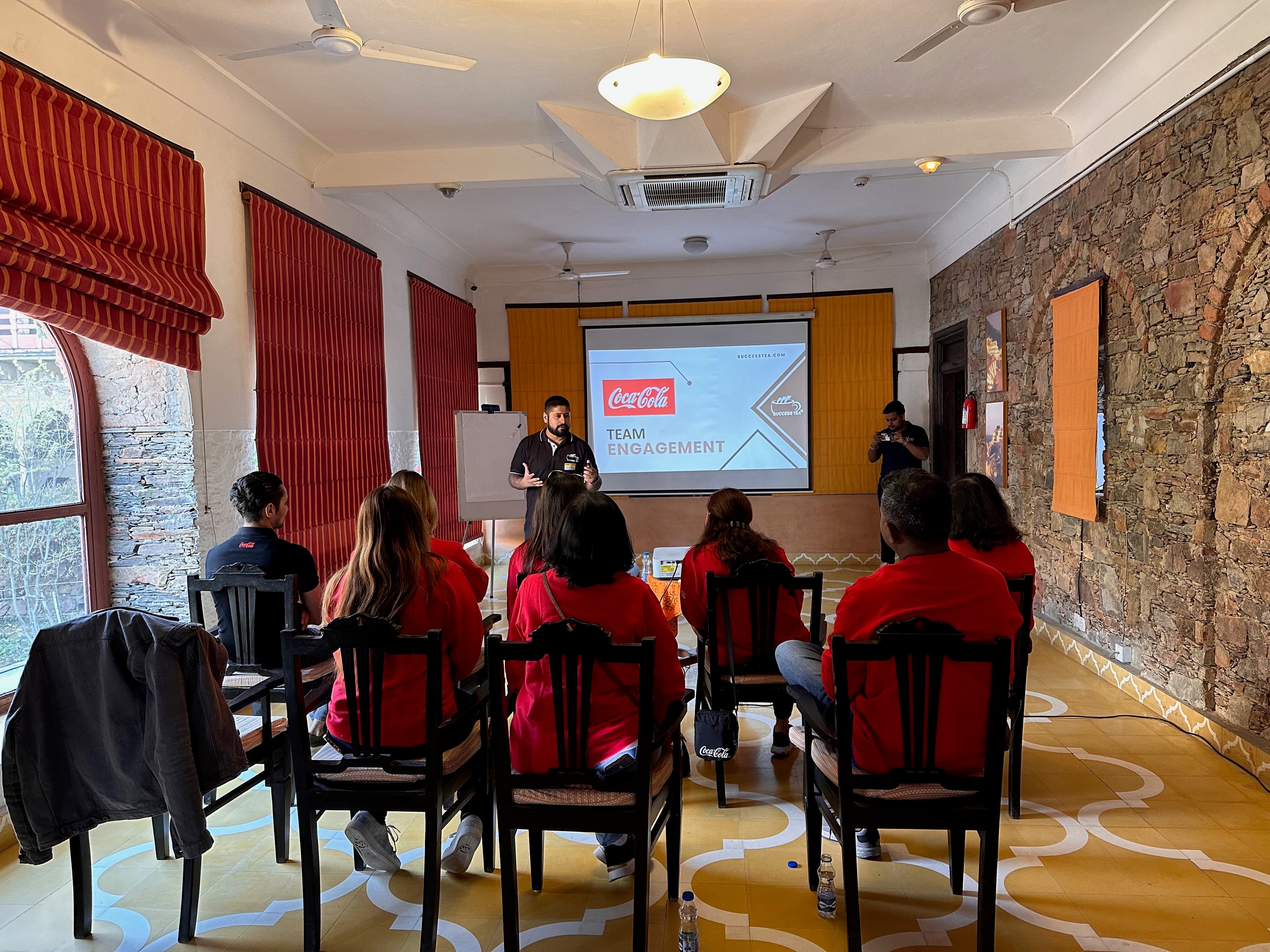A SuccessTea facilitator leading a focused team session